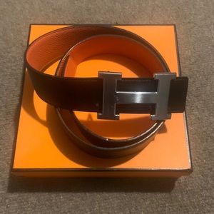 HERMES 32MM Reversible Black/Orange calfskin belt and palladium plated buckle.